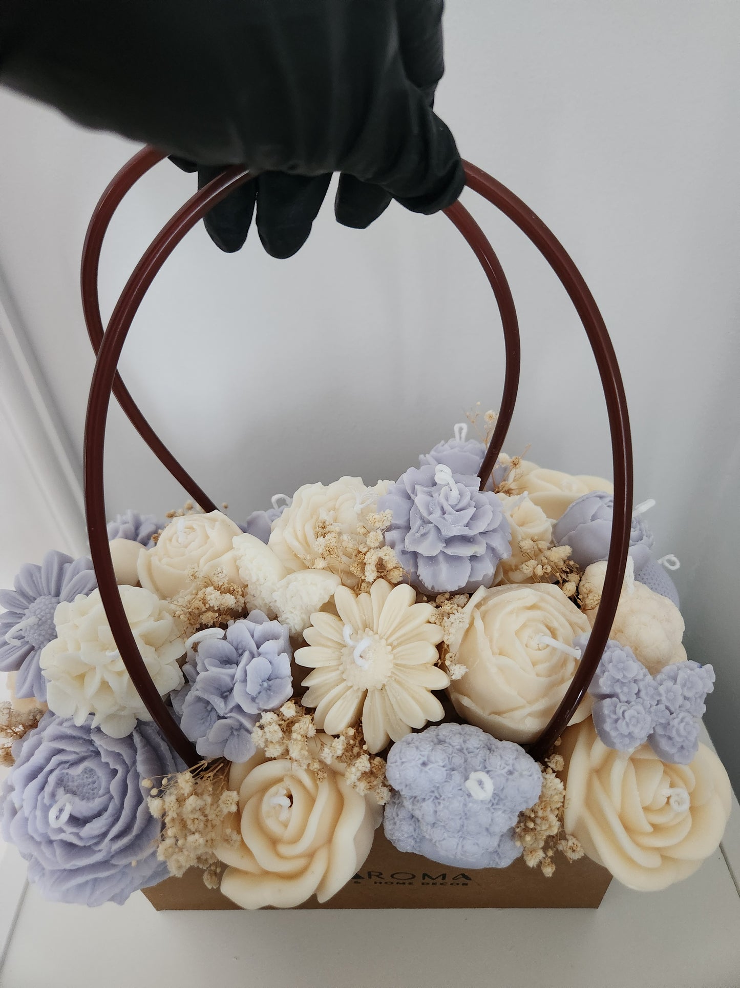 Sac de bougies en arrangement floral